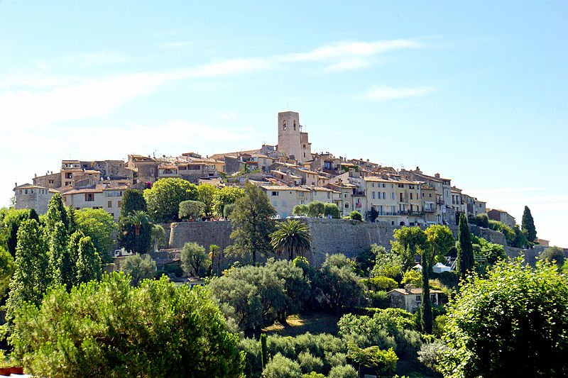 Saint-Paul-de-Vence — fortified hilltop village, ramparts and bell tower above the gardens.